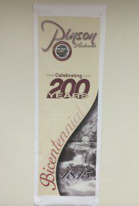 A vertical banner hangs in Pinson City Hall. Trussville Tribune file photo