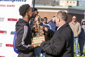Clay-Chalkville wide receiver T.J. Simmons kisses the Army National Guard national ranking trophy. photo by Ron Burkett