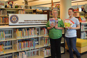 Children’s Assistant Karen Davis (left) and Children’s Librarian Rebecca Burchfield with a selection of easy readers provided by Trussville Noon Rotary Club. submitted photo
