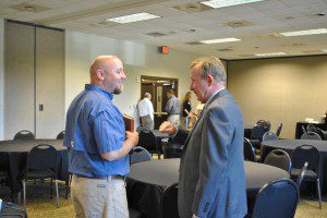WVTM-TV anchor Mike Royer (right) speaking with Chaplain Eddie Adams at the recent first responders breakfast hosted by the Trussville Area Chamber of Commerce. submitted photo