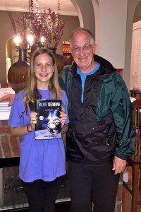 Trussville author Mike Jenne with granddaughter Anna Kate, to who his first novel, “Blue Gemini” is dedicated.