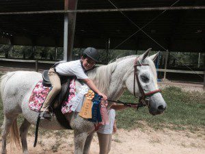 Preston Healy and his horse Issy show off four ribbons from his first show. Submitted photo