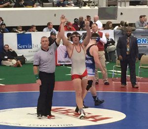 The Huskies' Davis Perry claimed the 182 lb state championship. Photo via Twitter