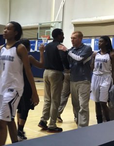 Coach Justin Haynie, right, congratulates Shades Valley coach Gary Ferguson after Clay-Chalkville lost a hard-fought 61-59 game in a Northeast Sub-Regional at Clay on Monday. Photo by David Knox/The Trussville Tribune