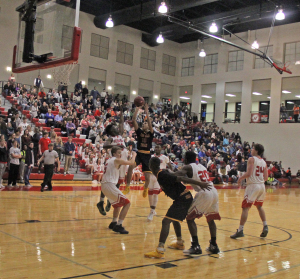 Pinson Valley's Colby Jones goes up for a shot in the lane Friday night at Hewitt-Trussville. Photo by Chris Yow
