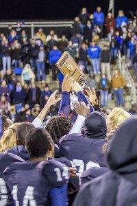 Clay-Chalkville players hoist the Class 6A North semifinal trophy. photo by Ron Burkett