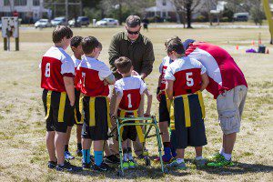 Coach Kenneth Hardin draws up a play for the Trussville Youth Flag Football Redskins, a Trussville Parks and Recreation team, in the spring of 2014. file photo by Ron Burkett