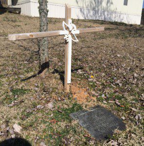 A plaque, cross and tree are located on the Chalkville Elementary School campus in memory of Larry Bevis, near where he was struck by a car in 2006.  photo by Gary Lloyd