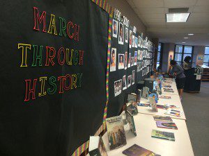 The wall of student-made posters for “March Through History” photo by Gary Lloyd