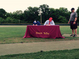 Pinson Valley's Jacob Brown and Blake Mayes sign their scholarship papers. photo by Kyle Parmley