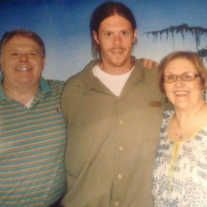 Carol Hobby and husband Joe during a recent family visit with their son, Matt (center), who is currently serving time in a federal prison. 