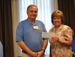 Diane Poole presenting a check to Rotary Club President Danny Cooner. submitted photo  