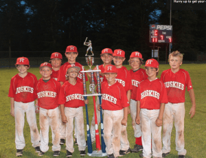 The 9U Huskies holding their state championship trophy. submitted photo 