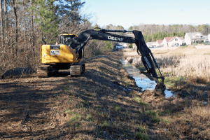 Construction on the berm that divides the detention pond from Birmingham’s Eastern Area Landfill. submitted photo