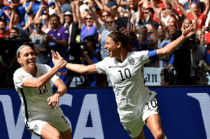 Lauren Holiday and Carli Lloyd celebrate with teammates after Lloyd scores her second goal against Japan in the final match of the 2015 FIFA Women's World Cup at the BC Place Stadium in Vancouver on July 5, 2015. photo by Rich Lam—Getty Images 