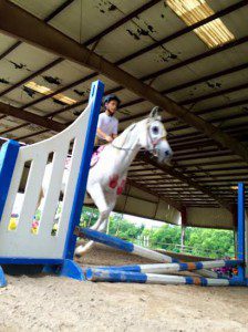 Preston jumping with his horse Issy. Submitted photo
