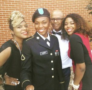 Aliyah Curry in her uniform surrounded by her family. Photo courtesy of Facebook
