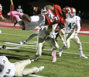 Hewitt running back Jarrion Street goes airborne Friday night. Photo by Chris Yow