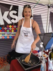 Karen Clark cooking with her own spices. Submitted photo