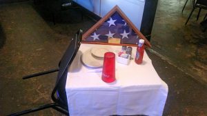 A Missing Man Table is set up at The Shack on Chalkville Mountain Lane in honor of James Grigsby's father, who was a decorated Vietman War veteran, as well as for all other veterans who have lost their lives in battle or since returning home. Photo by Chris Yow