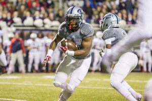 Clay-Chalkville running back A.J. Walker (5) carries the ball against Homewood in the Class 6A state playoffs in Cougar Stadium. Photo by Ron Burkett 