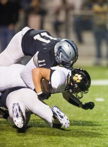 Clay-Chalkville linebacker Kenyon Hasberry (11) making a tackle on Thursday night. photo by James Nicholas