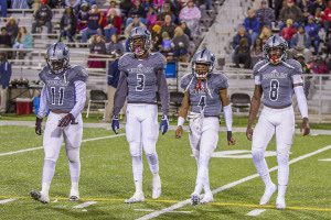 From left to right: Kenyon Hasberry, Amari Holloway, Dez Williams and Ty Pigrome prepare for a 40-39 playoff win over Homewood on Nov. 13 in Cougar Stadium. Photo by Ron Burkett  