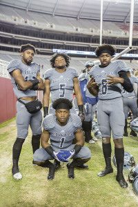 Brandon Berry (1) with Clay-Chalkville teammates T.J. Simmons (13), A.J. Walker (5) and Ty Pigrome (8) prior to the Class 6A Super 7 championship game in Tuscaloosa. Photo by Ron Burkett 