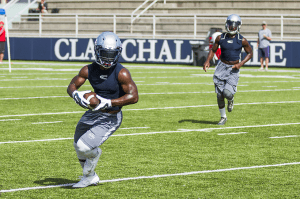Clay-Chalkville running back Brandon Berry pulls in a pass from Ty Pigrome last summer. Photo by Erik Harris 