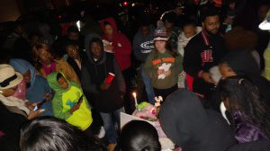 Friends of Raven White attend her vigil Sunday. Photo by Chris Yow