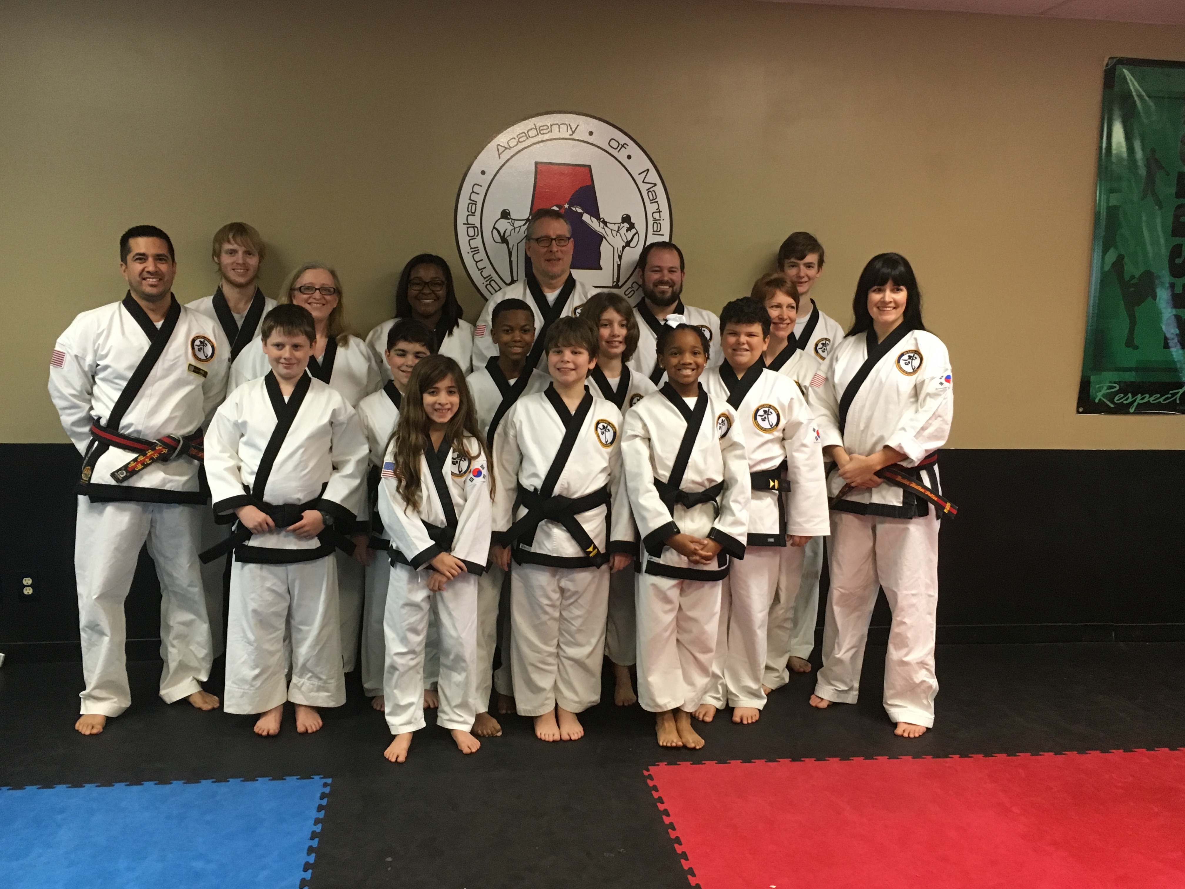 Local martial arts academy graduates 15 black belts 