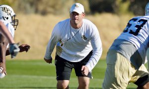 Brent Key, shown here working with Central Florida football players, has been named by Nick  Saban as the new University of Alabama offensive line coach. Key, formerly the offensive  coordinator and running backs coach at UCF, is a Hewitt-Trussville graduate.  -photo courtesy UCF Athletics Communications. 