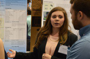 Amanda Green, a student at Hewitt-Trussville High School, discusses her research project with judges during the Alabama Science and Engineering Fair at The University of Alabama in Huntsville on Friday, April 1. Teaming with Emma Burford on this project, they won a sponsored award from the Huntsville section of IEEE. Photo by Phil Gentry/UAH
