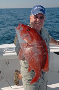 Mark Jones of Mobile shows off a beautiful red snapper that came off one of those reefs. (David Rainer)