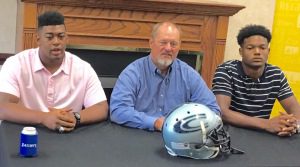 Cougars coach Jerry Hood, center, flanked by Keilend Clayton, left, and Nico Collins, right, talks to members if the media on Monday at Gardendale Civic Complex during High School Football Media Days. Photo by David Knox