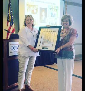 Diane Poole, executive director of the Trussville Area Chamber of Commerce, was  named 2016 Chamber Executive of the Year at the Chamber of Commerce Association of Alabama's Summer Conference at Perdido Beach Resort last week. Presenting the award is CCAA's Board President Morri Yancy.