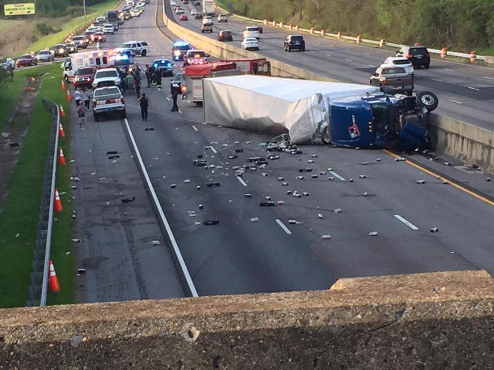 Tractor trailer overturned, blocking Interstate