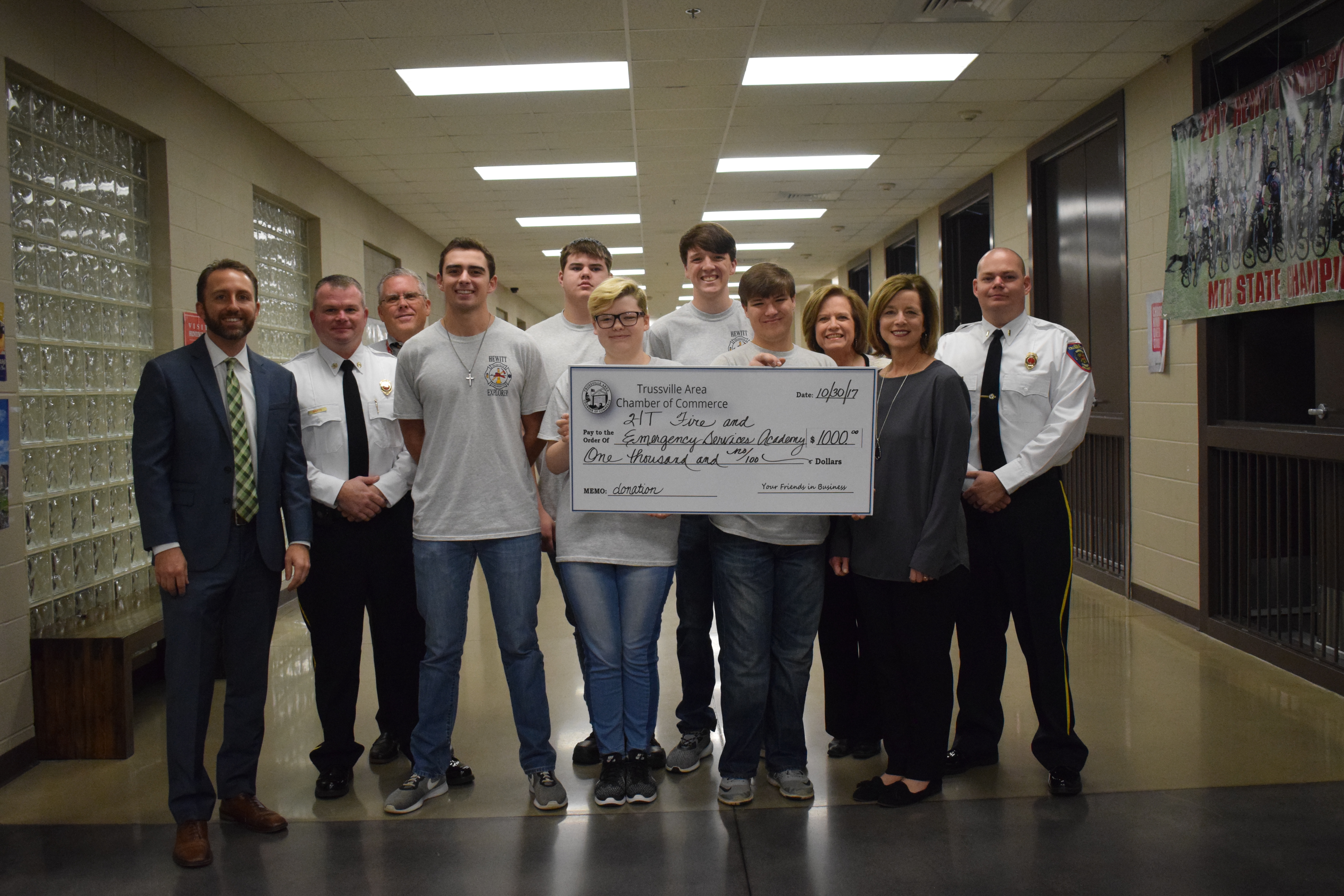 Trussville fire academy receives $1,000 check from Chamber of Commerce
