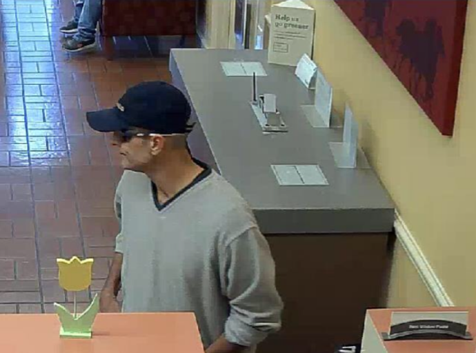 Bank robbed at the Summit, police release suspect photos