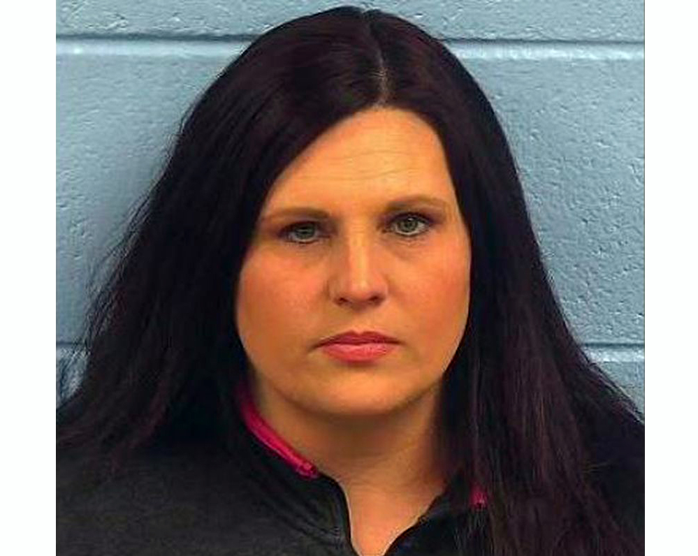 Woman arrested on charges of child abuse after hitting teen with paddle