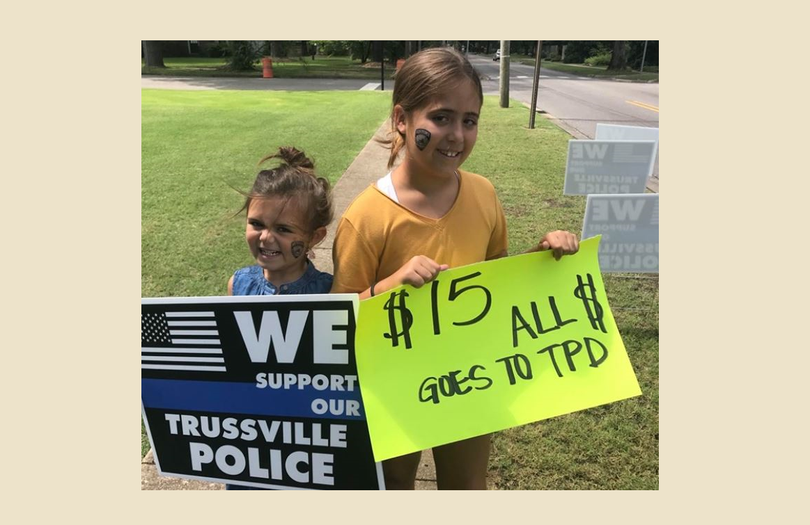 Trussville girls raising money for PD by selling signs of support