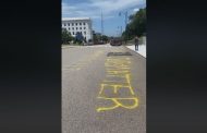 Black Lives Matter” and “Expand Medicaid” painted on street in front of Alabama Capitol