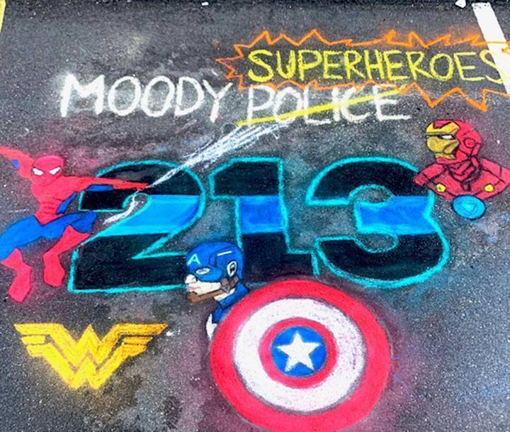 Sidewalk chalk art at Moody church honors local heroes