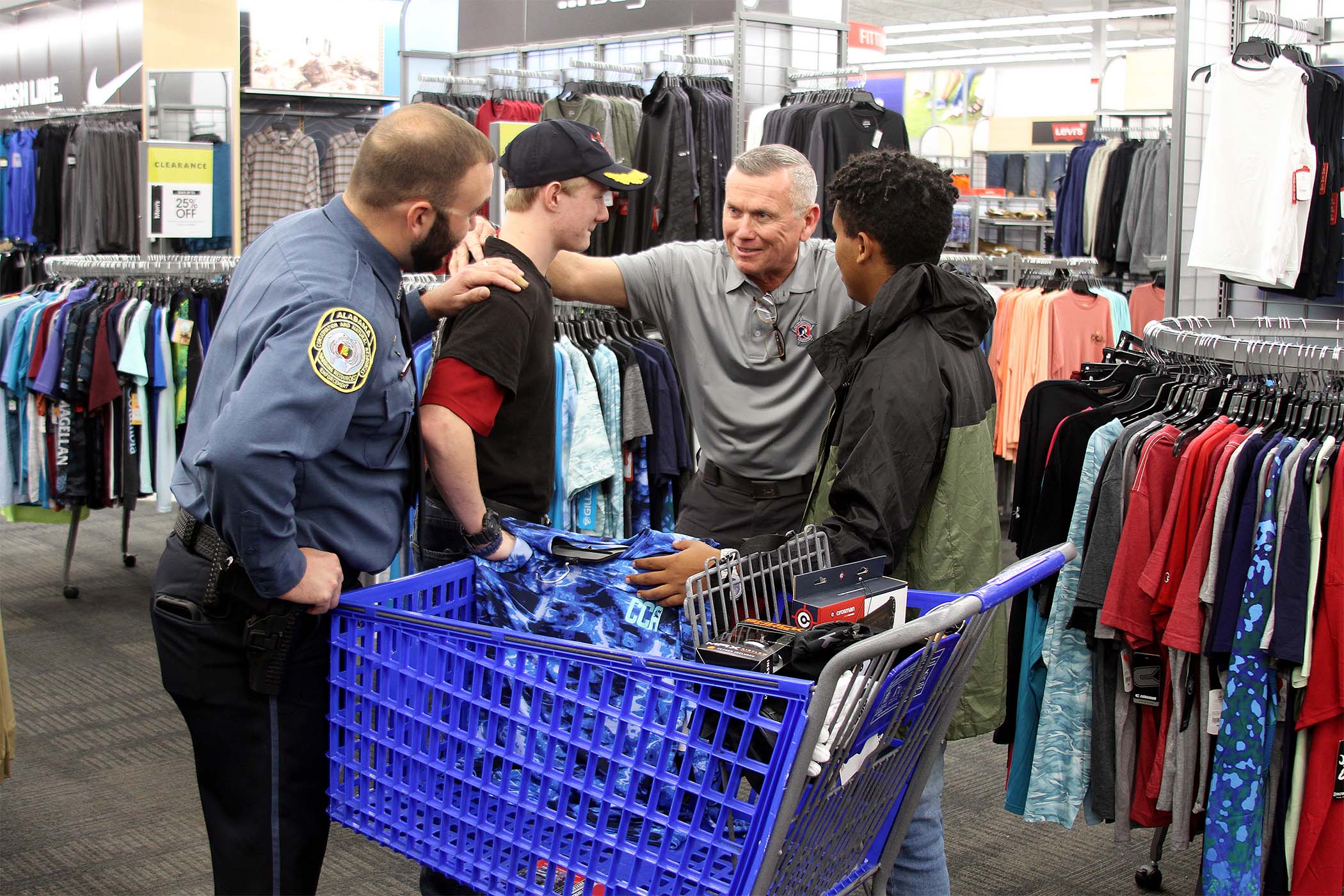 ADCNR officers aid youth at shop with a cop events