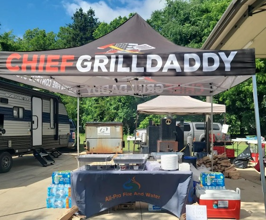 Chief Grilldaddy cooking at Pinson Bicentennial Park today celebrating Telecommunicator Week