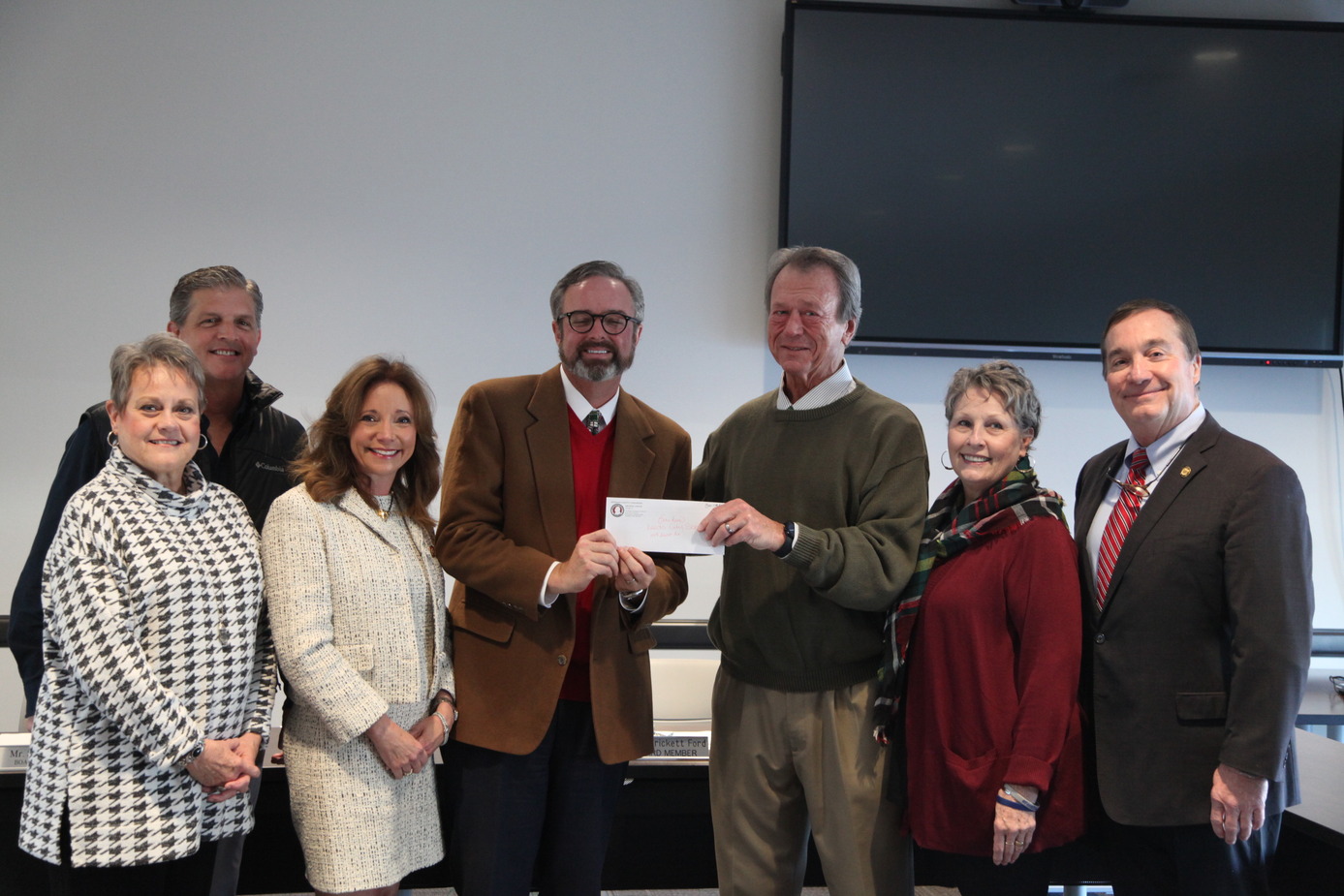 Leeds Board of Education presented check by county commission for athletic facility project